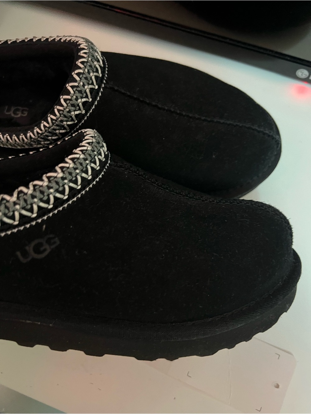 UGG Black Suede Slip-On Tasmans slippers with Braided Trim